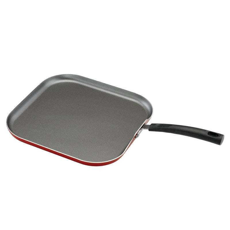 Red bottom griddle with black handle on white background
