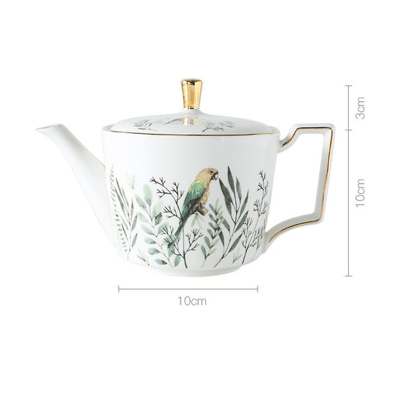 Teapot with bird and leaf design, featuring dimensions on a white background