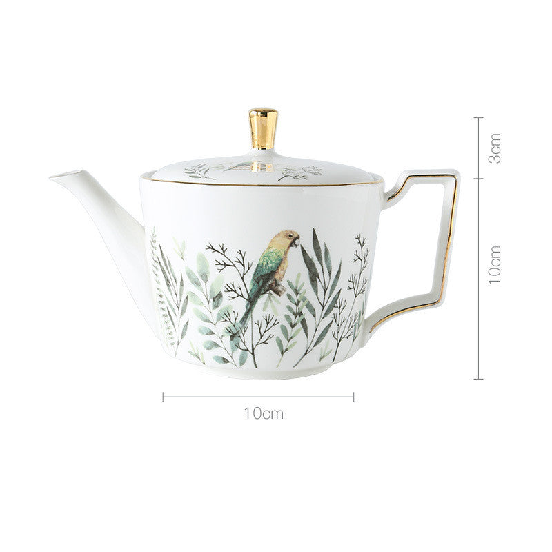 Teapot with bird and leaf design, featuring dimensions on a white background