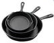 Set of three cast iron skillets of different sizes on a white background