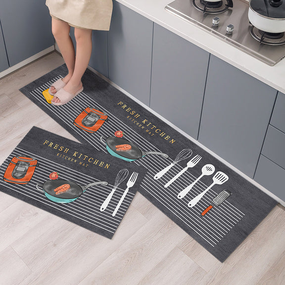 Two kitchen-themed mats on a wooden floor with a kitchen background.