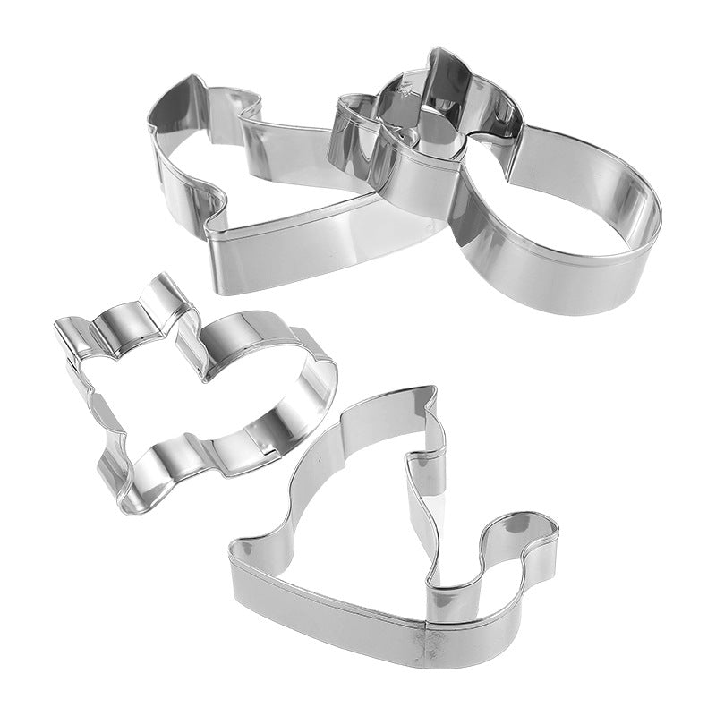 Set of four metal cookie cutters on a white background