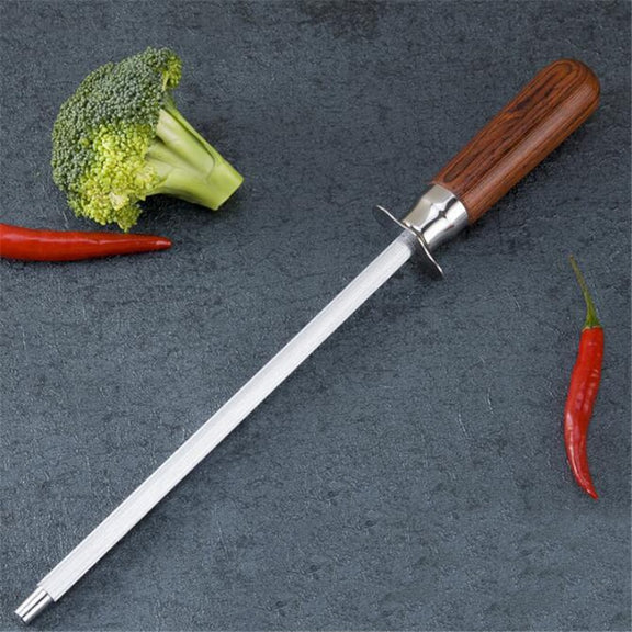 Knife Sharpener with wooden handle on a dark surface with vegetables