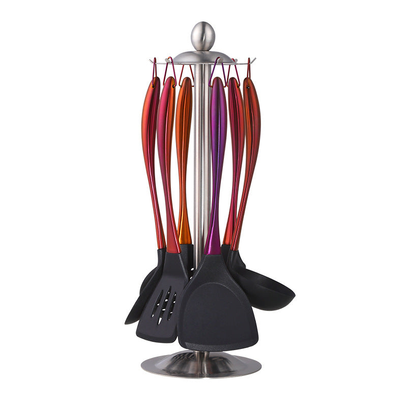Set of colorful kitchen utensils on a stand with a white background
