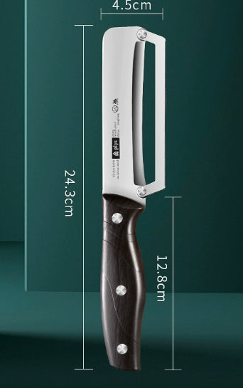 Peeling knife with a black wooden handle and metal blade on a green background