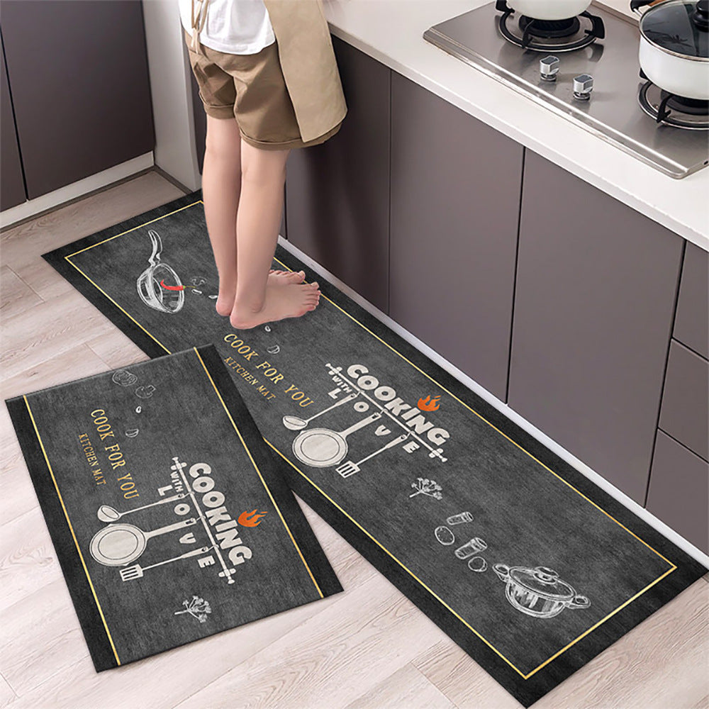 Two kitchen mats with cooking-themed designs on a wooden floor.