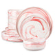 Set of ceramic bowls with pink and white marbled pattern on a white background