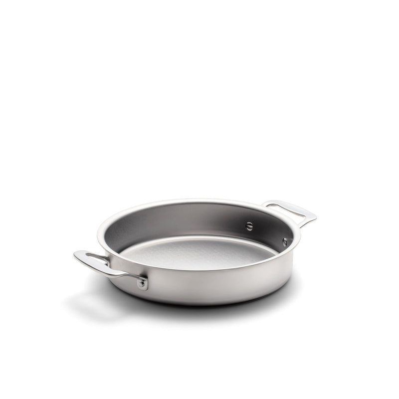 Stainless steel frying pan on a white background