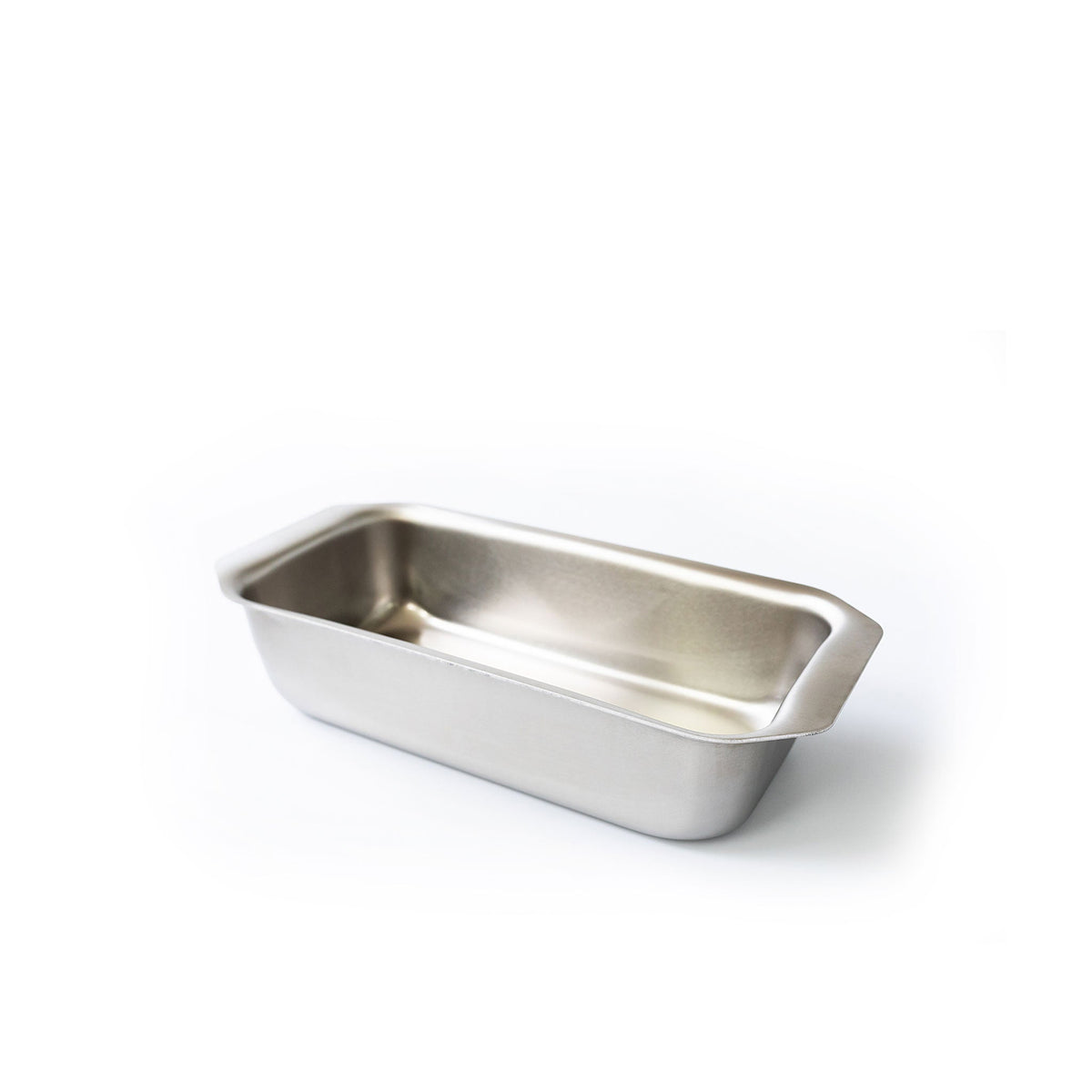 Stainless steel loaf pan on a white background