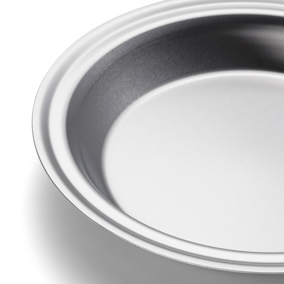 Close-up of a metallic bowl on a white background