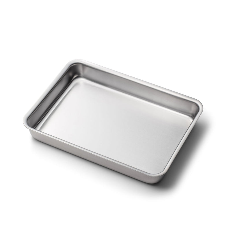 Stainless steel baking tray on a white background