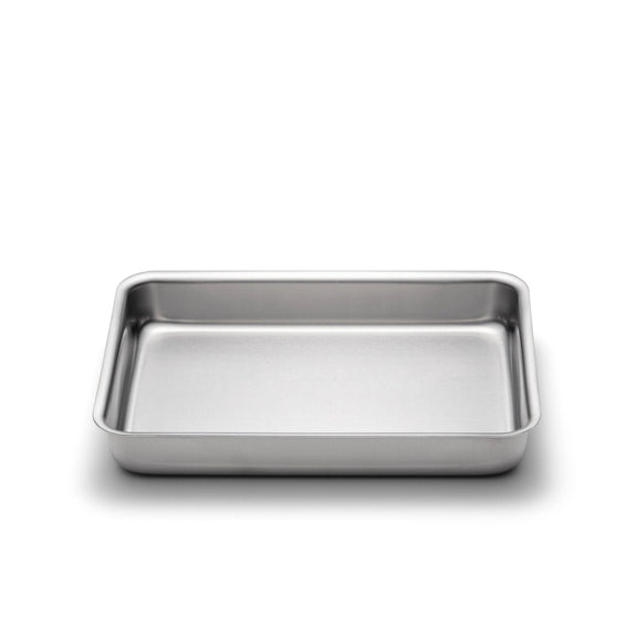 Stainless steel baking tray on a white background