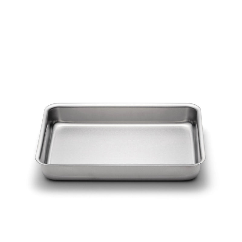Stainless steel baking tray on a white background