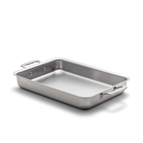 Stainless steel roasting pan on a white background