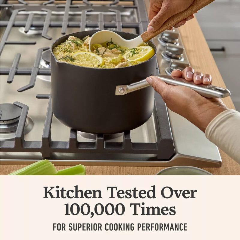 Person stirring a pot of food on a stove with text about kitchen testing.