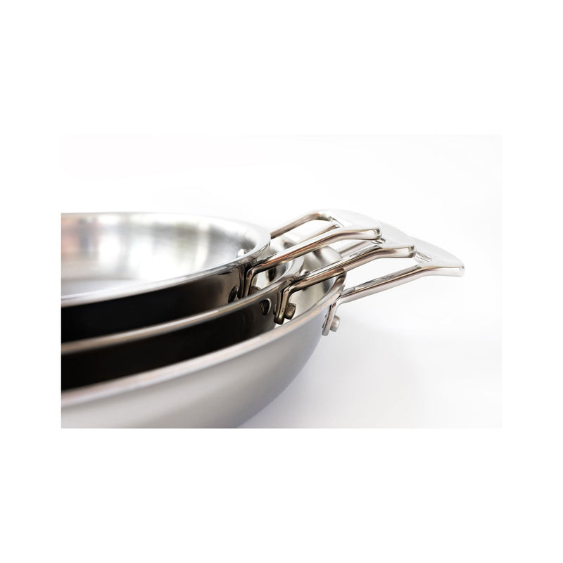 Stainless steel frying pans with handles on a white background