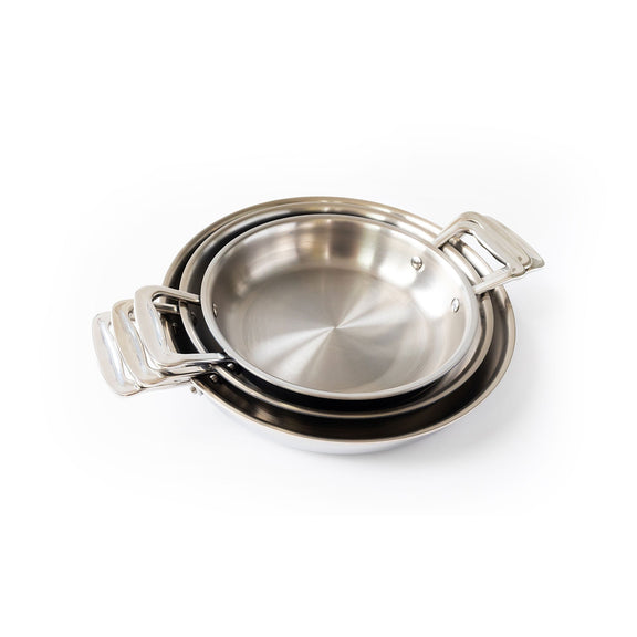 Set of three stainless steel cookware pots on a white background