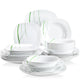 Set of white dinnerware with green patterns on a white background