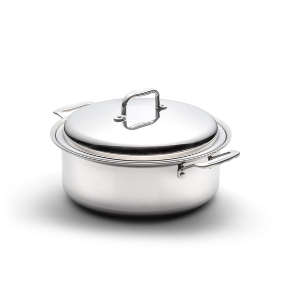 Stainless steel pot with lid on a white background
