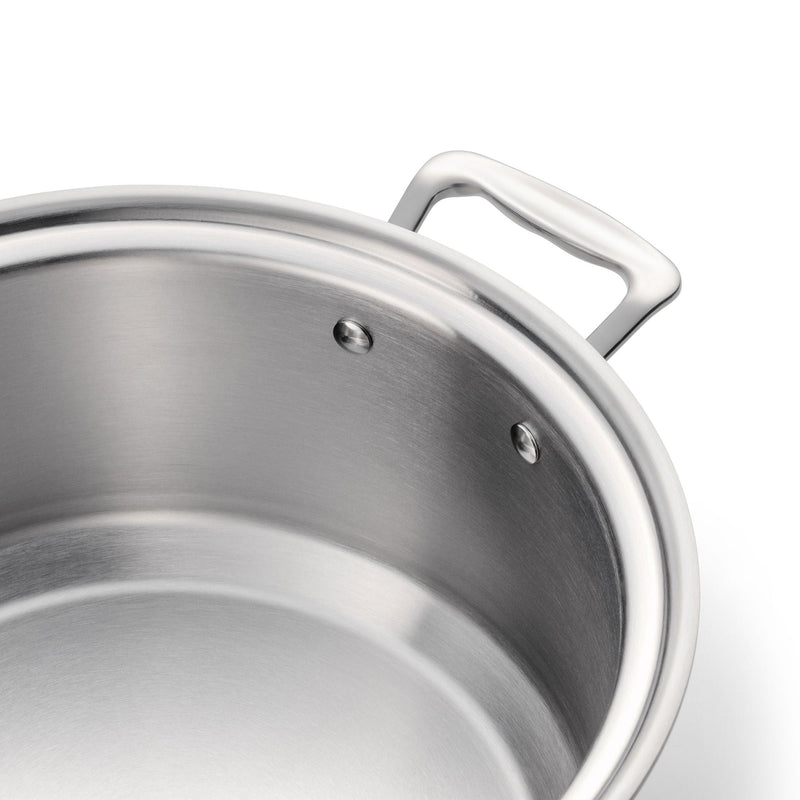 Close-up of a stainless steel pot with a handle on a white background