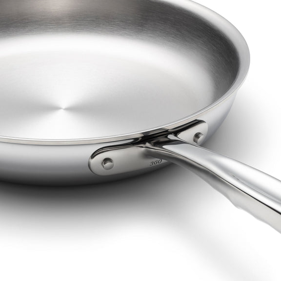Stainless steel frying pan on a white background