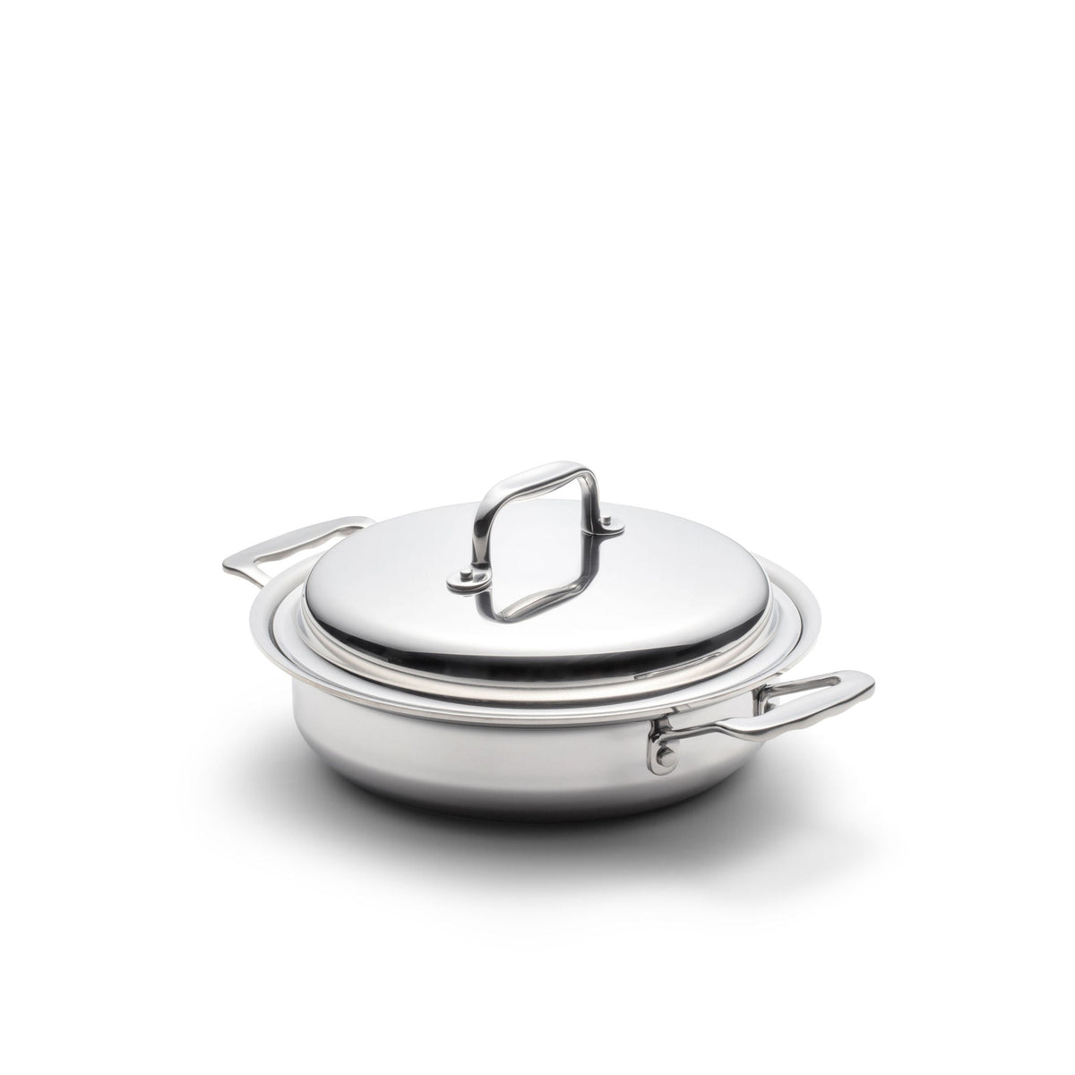 Stainless steel pot with lid on a white background