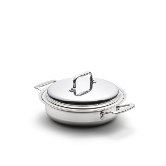 Stainless steel pot with lid on a white background