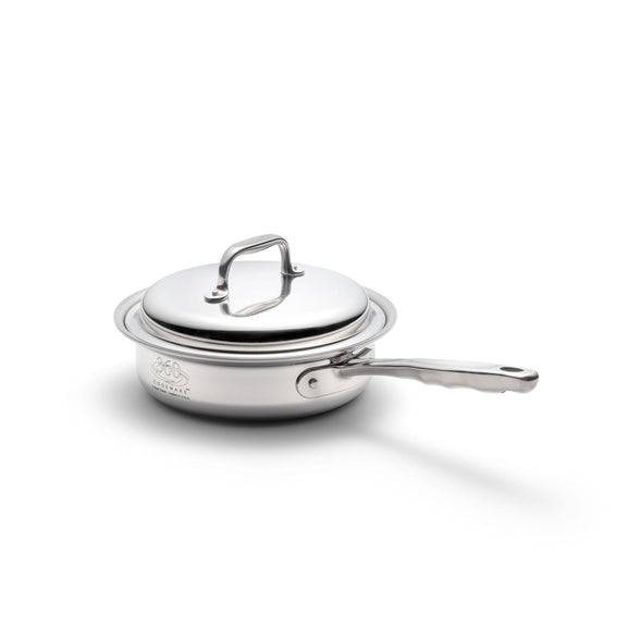 Stainless steel sauté pan with lid on a white background