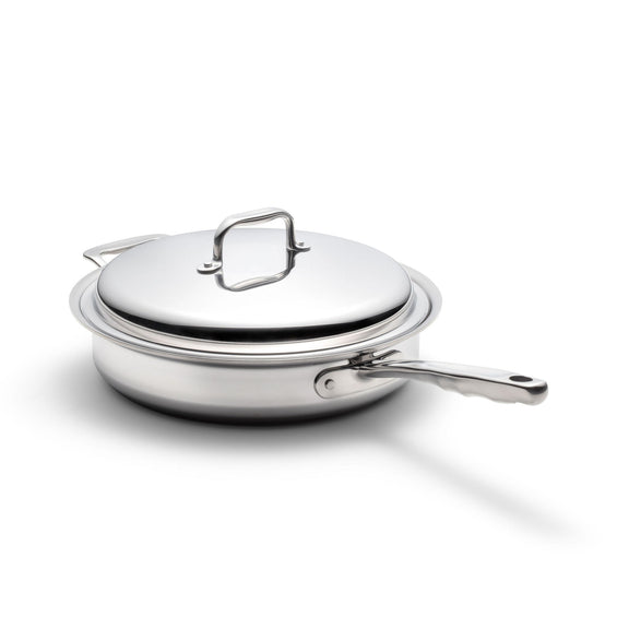 Stainless steel frying pan with lid on a white background