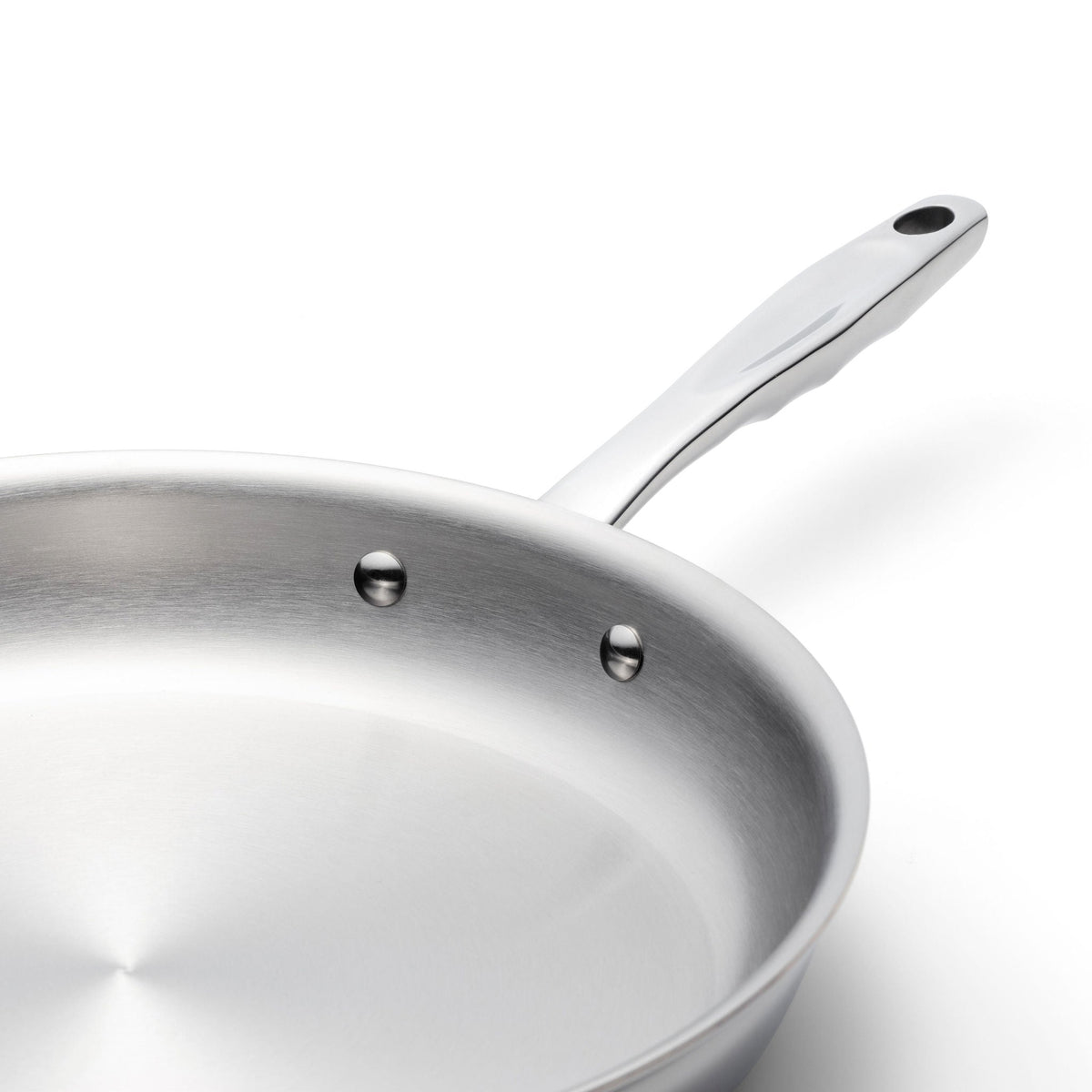 Stainless steel frying pan on a white background