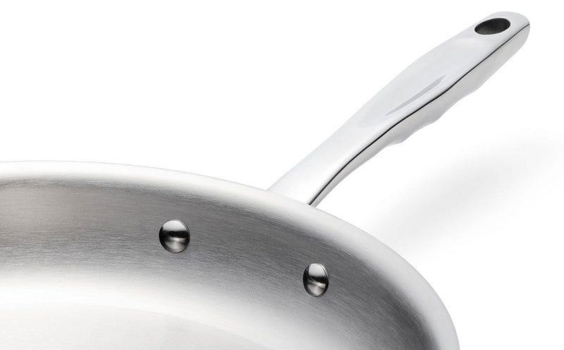 Stainless steel frying pan with a handle on a white background