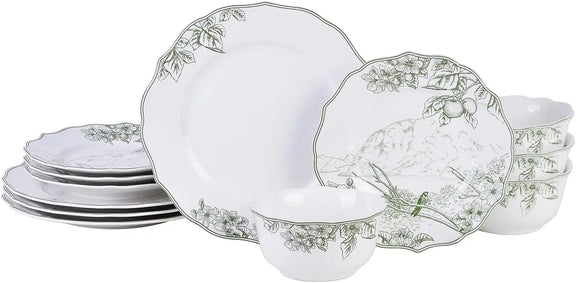 Set of white ceramic plates with decorative green patterns on a white background