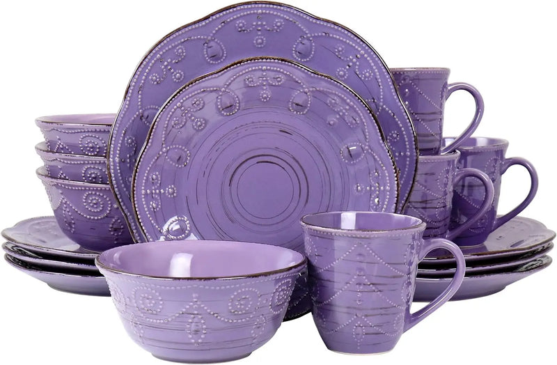 Purple ceramic dinnerware set with cups and bowls on a white background