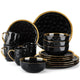 Black ceramic dinnerware set with gold accents on a white background