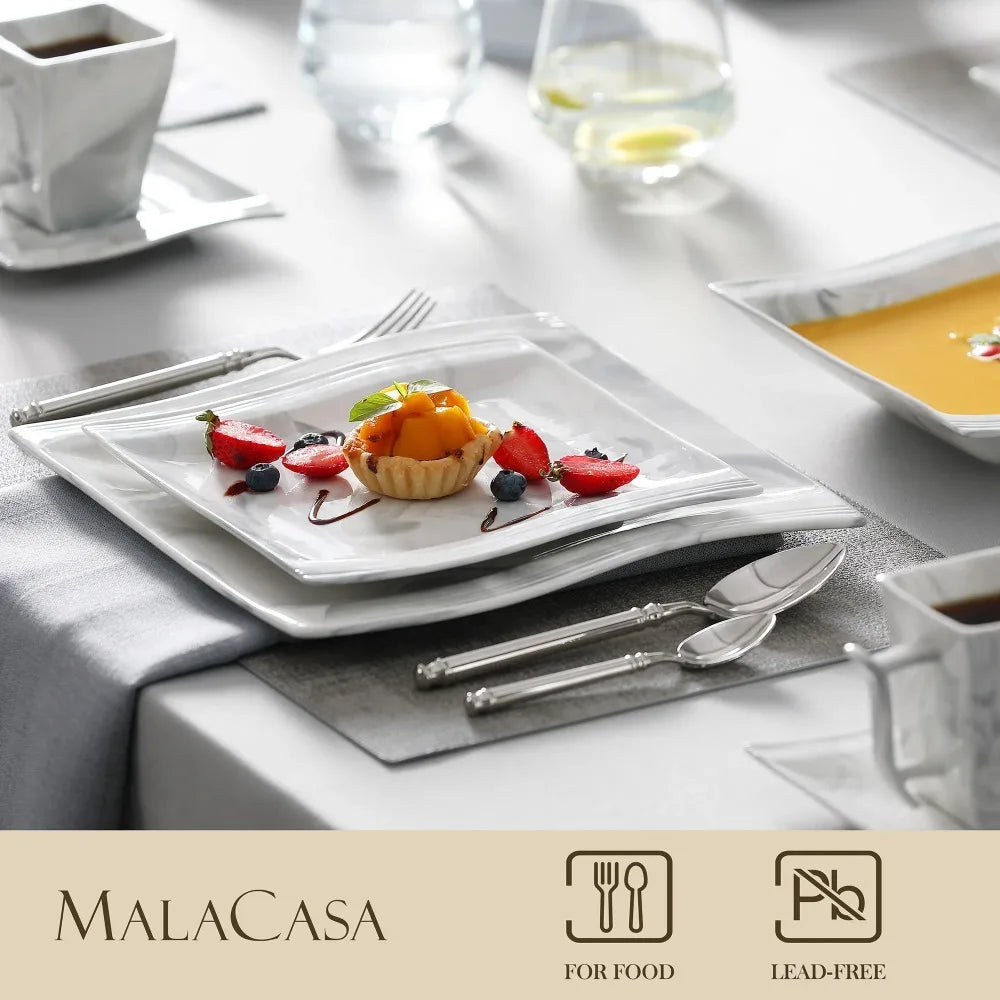 Elegant table setting with dessert on a Malacasa plate, featuring the brand's logo and certification icons.