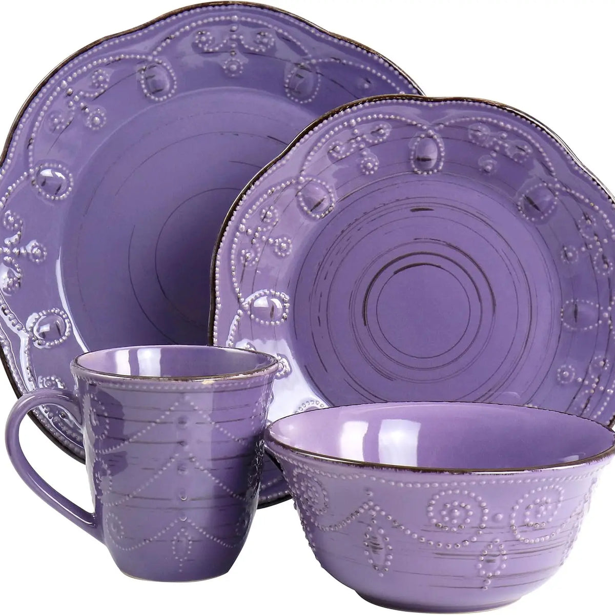 Purple ceramic dinnerware set with decorative patterns on a white background