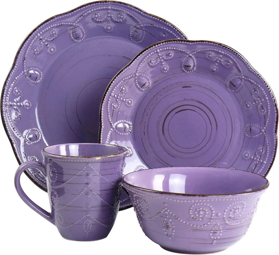 Purple ceramic dinnerware set with decorative patterns on a white background