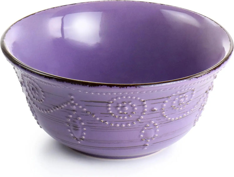 Purple ceramic bowl with decorative patterns on a white background