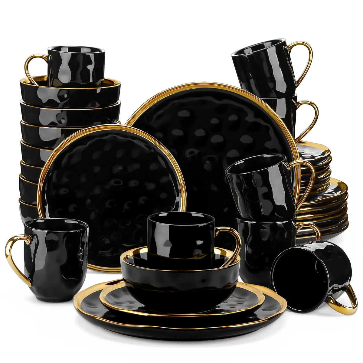 Black ceramic dinnerware set with gold accents on a white background