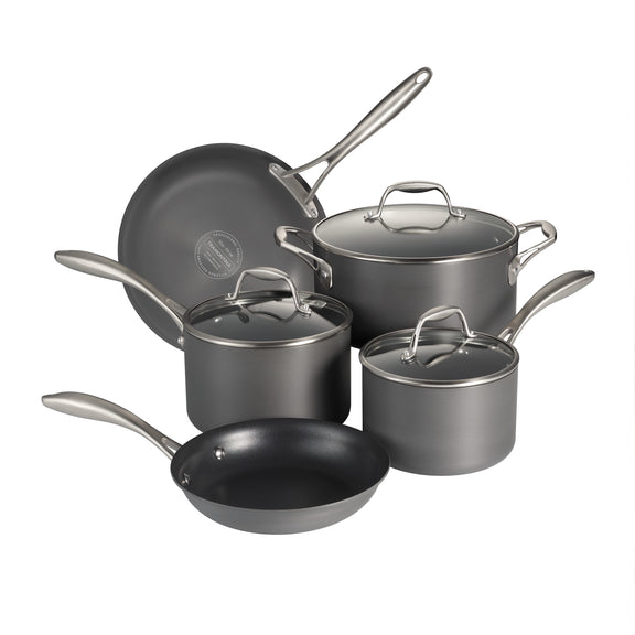 Set of gray cookware with lids on a white background