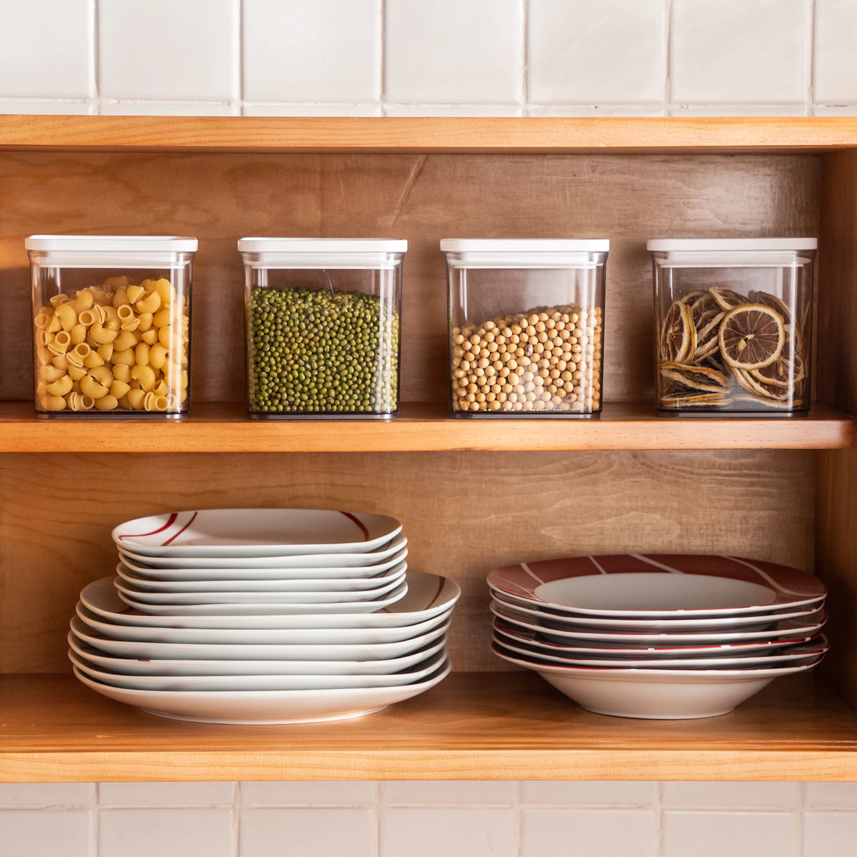 Kitchen shelves with storage containers and dinnerware