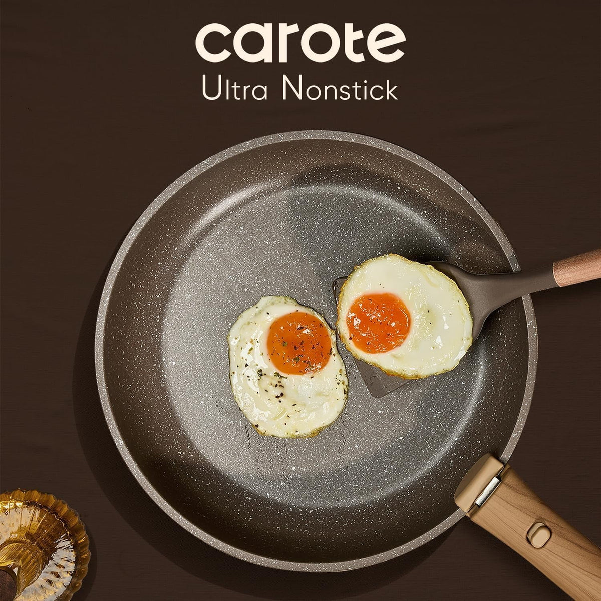 Carote ultra nonstick frying pan with two fried eggs on a brown background