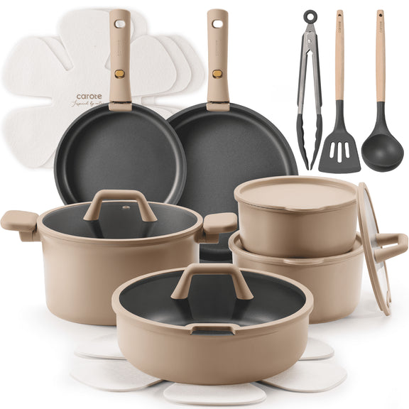 Set of cookware including pots, pans, and utensils on a white background