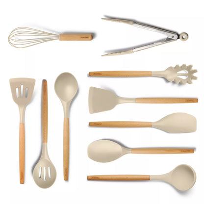 Set of kitchen utensils including a whisk, tongs, spatulas, and spoons on a white background