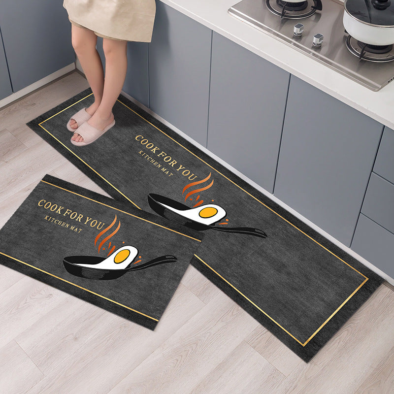 Two kitchen mats with cooking-themed design on a floor.