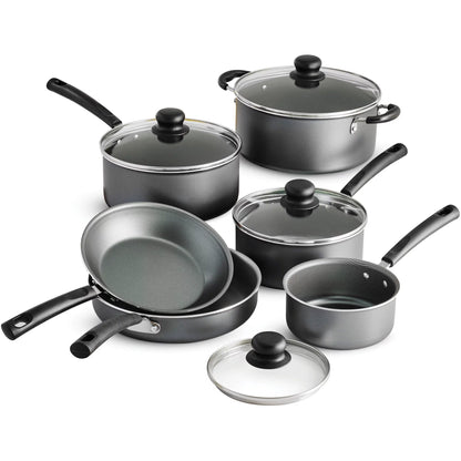 Set of black cookware with glass lids on a white background