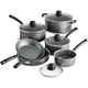 Set of black cookware with glass lids on a white background