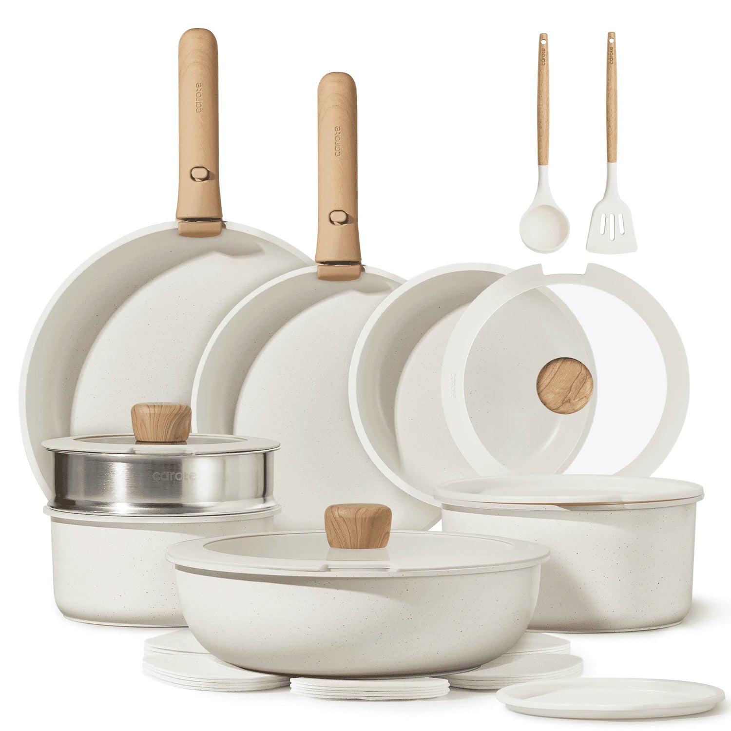 Set of white cookware with wooden handles on a white background