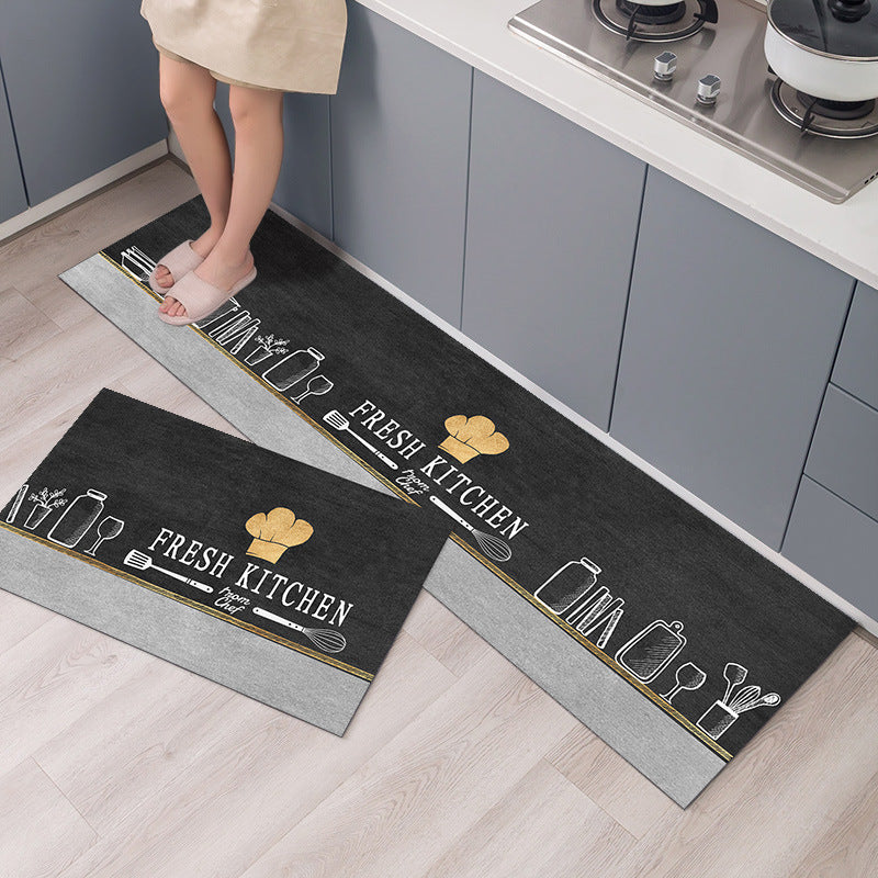 Two kitchen mats with 'Fresh Kitchen' text and utensil designs on a wooden floor.