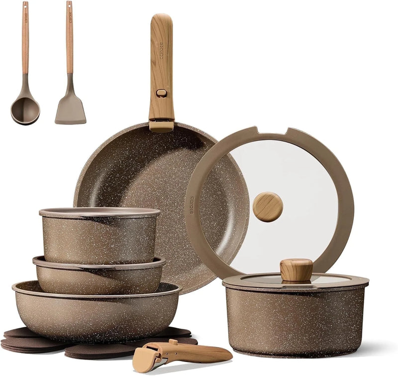 Set of cookware including pots, pans, and lids on a white background